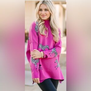 Shop The Mint Pink Zebra Print Sweater
Size Small
